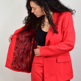 Model wearing a red blazer showing the jacket inside