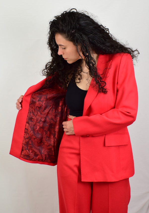 Model wearing a red blazer showing the jacket inside