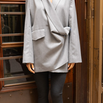 Model wearing a gray oversized blazer