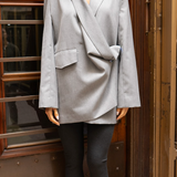 Model wearing a gray oversized blazer