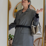 Model wearing a gray oversized blazer