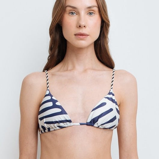 Model wearing a stylish nautical-themed triangle bikini top with blue and white stripes from EVAMAIA Boutique in Studio City, CA.