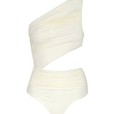 Image of a white one-shoulder swimsuit with a cutout on the side. The purpose of this image is to highlight the swimsuit because it's for sale at EVAMAIA boutique.