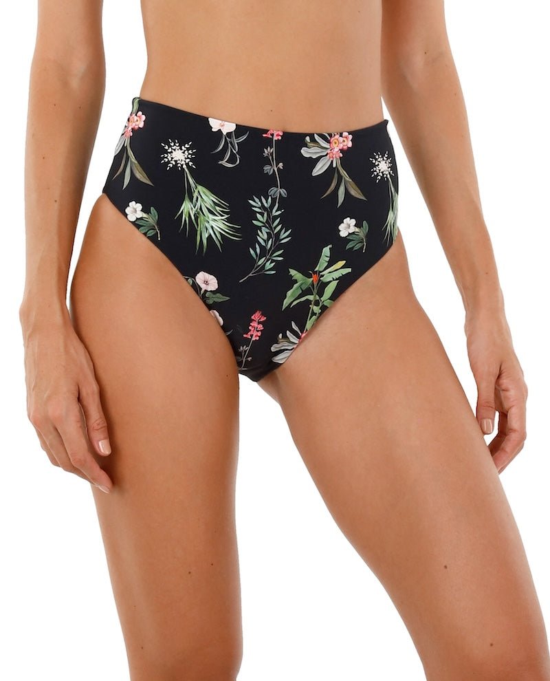 Close up image of a woman. She's wearing a swimsuit with flowers. The purpose of this image is to highlight the swimsuit.