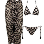 Image of a black and white bikini set and matching sarong. They are set on a white background. The purpose of this image is to highlight the clothing because it is for sale at EVAMAIA boutique in Studio City, CA.